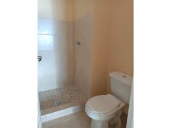 Small bathroom walk-in shower tile affordable house Arraiján Panama