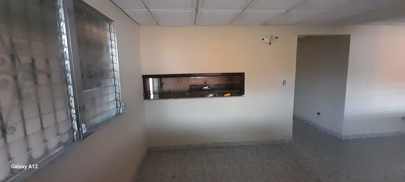 Bright space with kitchen pass-through window tiled flooring Don Bosco Panama City
