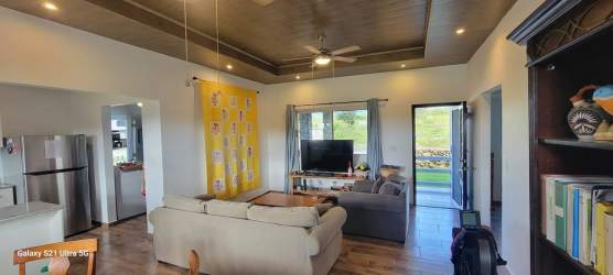 Modern bathroom with glass shower enclosure and mosaic tile accents Alto Boquete Panama rental