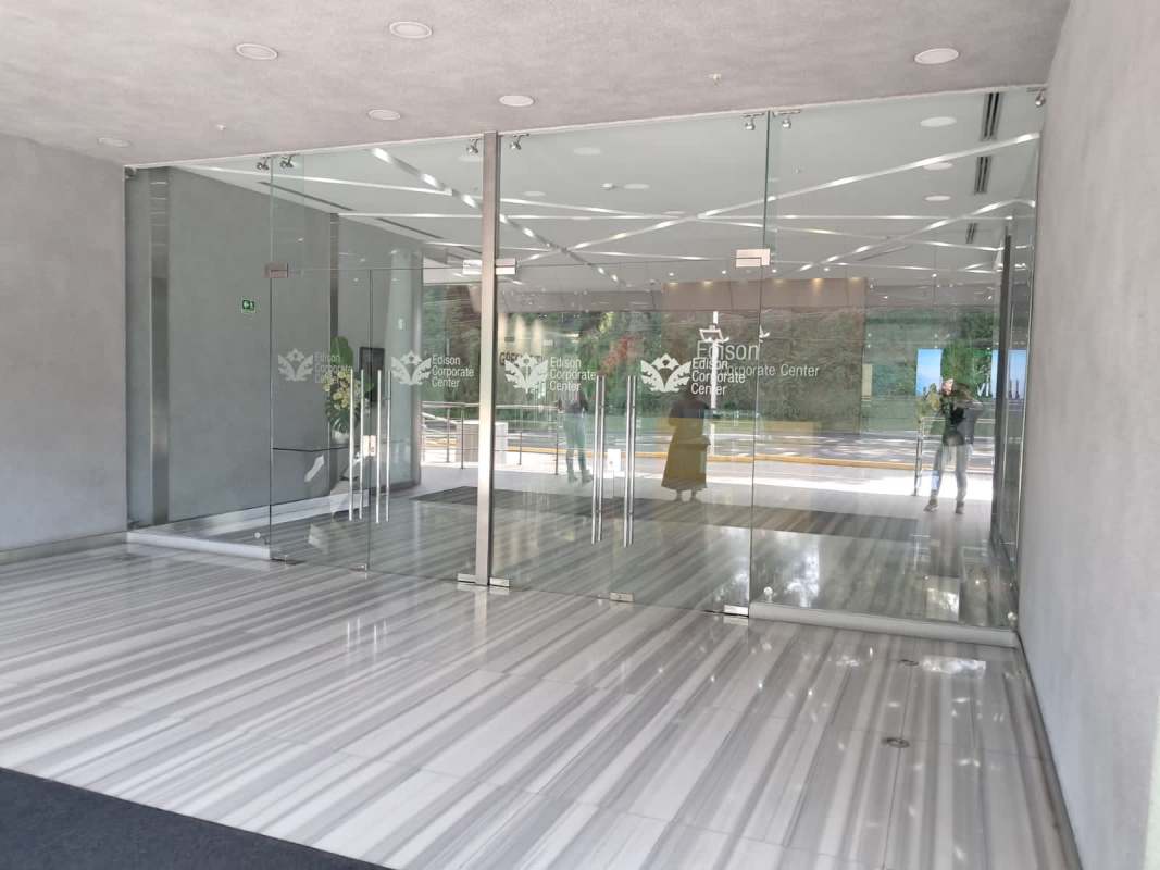Office corporate facade with glass entry doors and marble floor Edison Corporate Center Tower B Panama