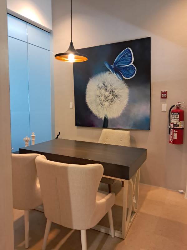 Contemporary dining area with table, chairs, wall art Edison Corporate Tower Edison Park Panama