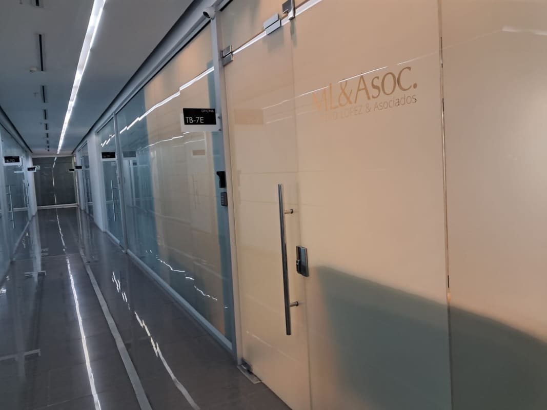 Modern office floor corridor with glass walls, lighting, secure access Edison Corporate Center Panama City