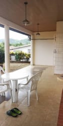 View of driveway, carport, and tiled entry at Villa Laura home in Panama Oeste