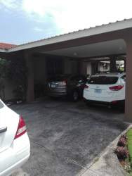 Garden space with grass fenced backyard water reserve tank Central David house Chiriquí