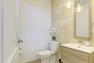 Spacious penthouse living room with floor-to-ceiling windows and ocean view at Punta Caelo Panama