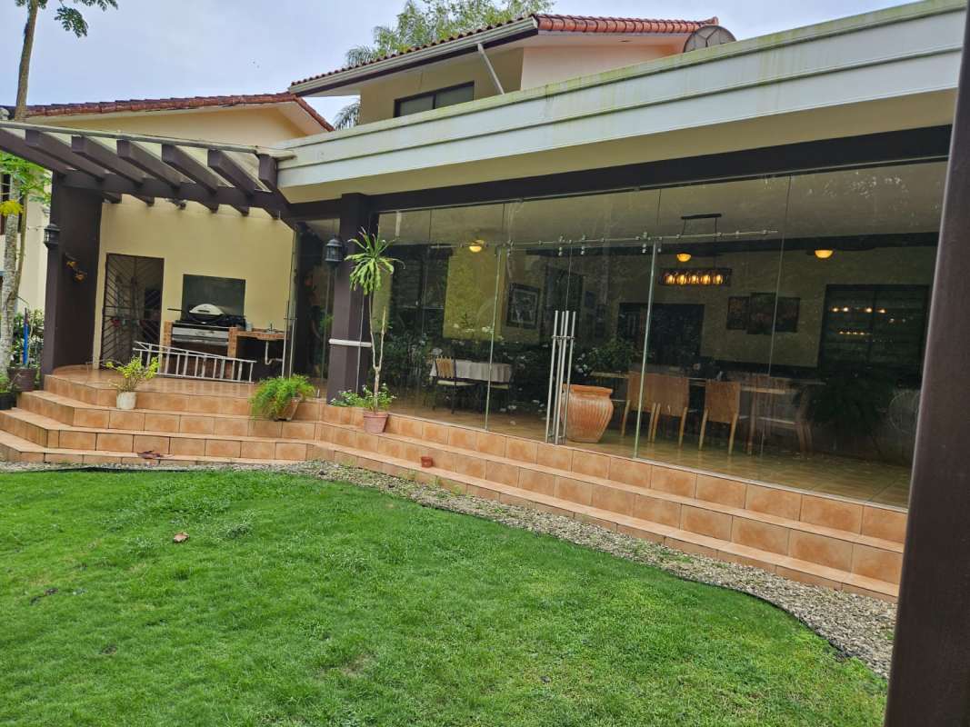 Private backyard with jacuzzi spa, BBQ and covered terrace in luxury Panama home