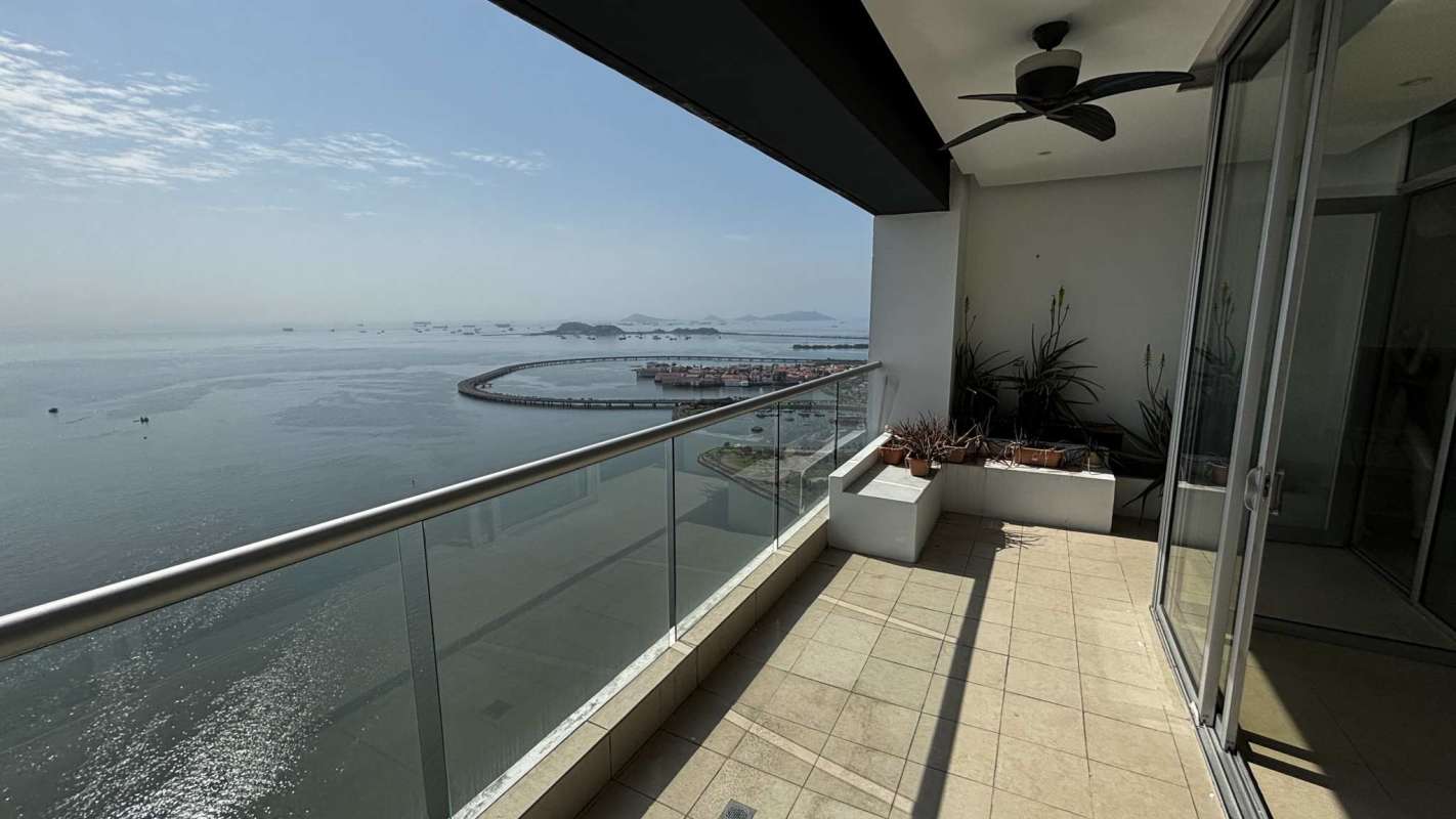 Spacious living dining area with large windows and ocean views PH Rivage Panama City