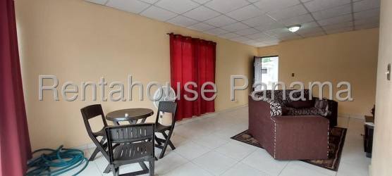 Kitchen with window curtains, overhead cabinets and double sink La Chorrera Panama
