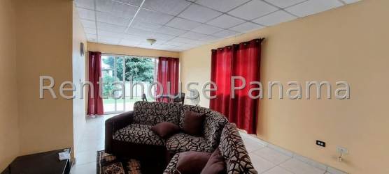 Living room with tiled floor, sectional sofa and large window Sausalito Gardens La Chorrera Panama