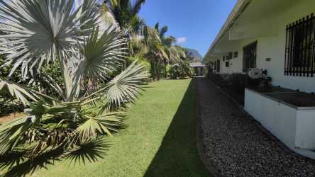 Exterior single level home with landscaped garden, mountain views in El Valle Coclé Panama