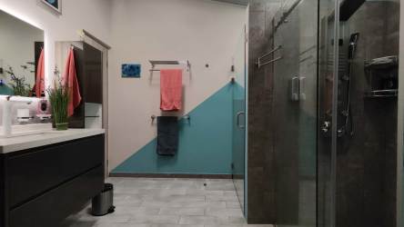 Balcony with lounging chairs overlooking pool, garden and mountains at El Valle Coclé Panama