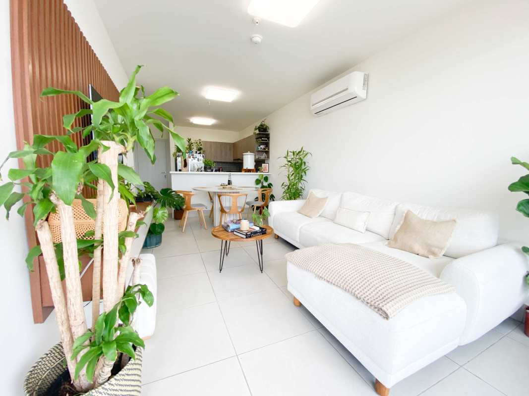 Open concept kitchen and living room with balcony access at PH Coco Place, Coco del Mar Panama City