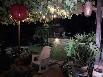 Covered patio with garden view night lights and plants country house Los Lirios Panama