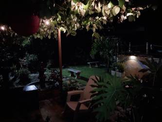 Garden patio illuminated at night tropical landscape country house Los Lirios San Carlos