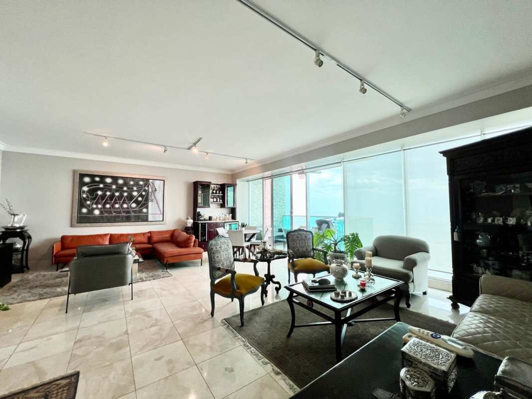 Spacious bedroom with floor to ceiling ocean view windows at PH Ocean Two Panama