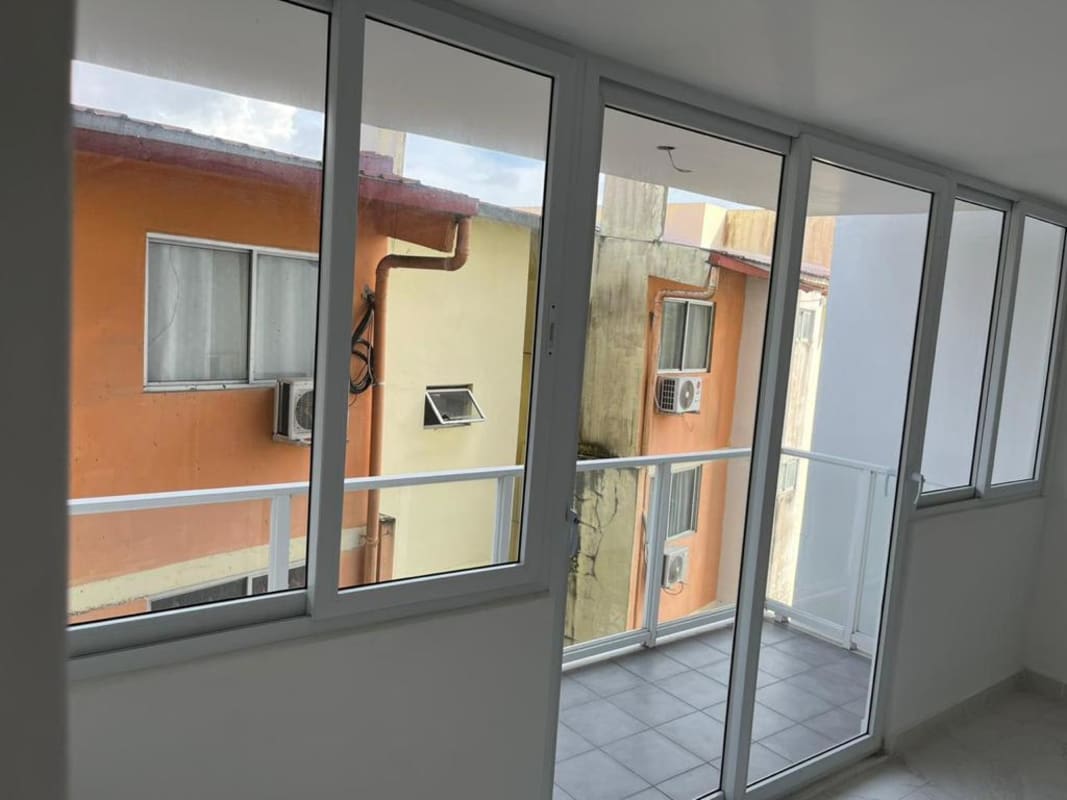 Private enclosed balcony sunroom space corner windows Mystic Gates Panama