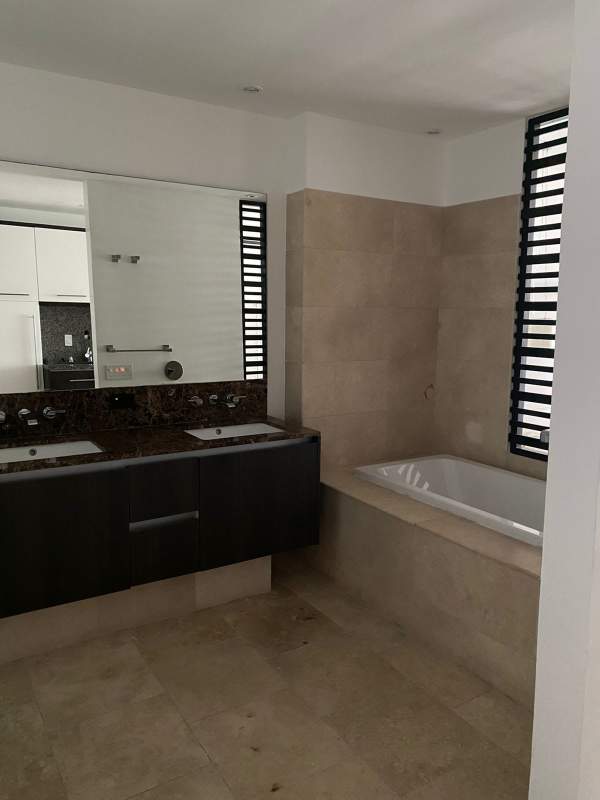 Modern furnished studio apartment marble floors large window ocean view JW Marriott Panama