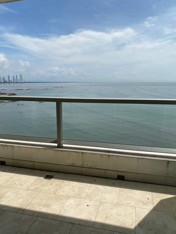 Modern bathroom double vanity, marble tiles, bathtub and shower studio apartment Panama City