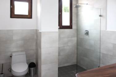 Mediterranean-style condo-hotel exterior with balconies and terracotta roof Pedasi Panama