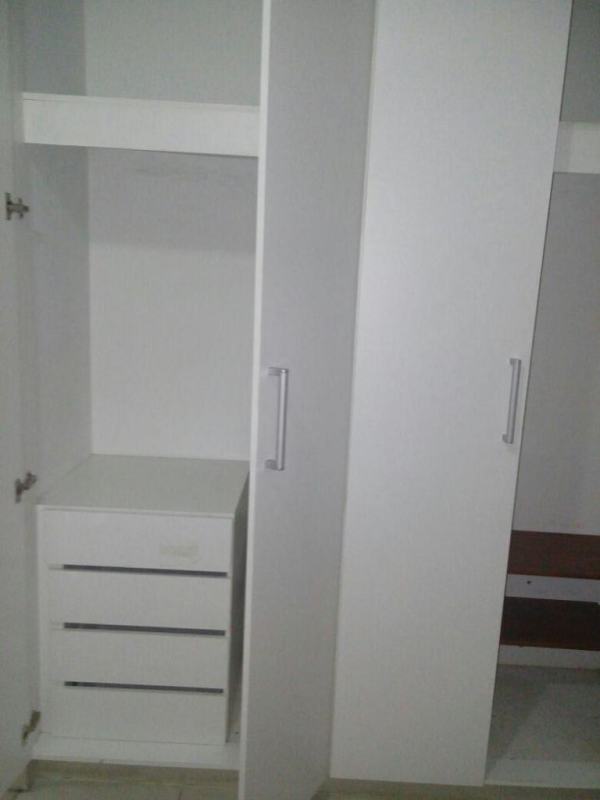 Kitchen with integrated laundry space stacked washer cabinets granite countertops at PH Mystic Tower Chanis Panama