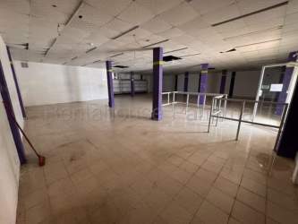 Open and bright commercial interior with tiled floor and glass storefront Costa Verde Chorrera