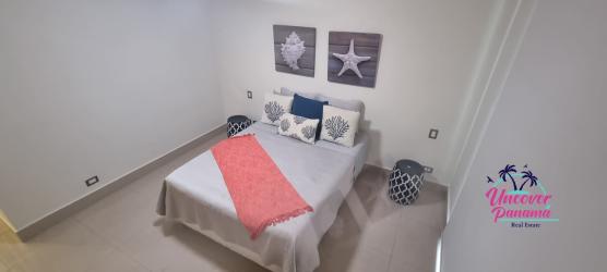 Contemporary kitchen with granite countertops and stainless appliances in luxury oceanfront condo Casamar Panama