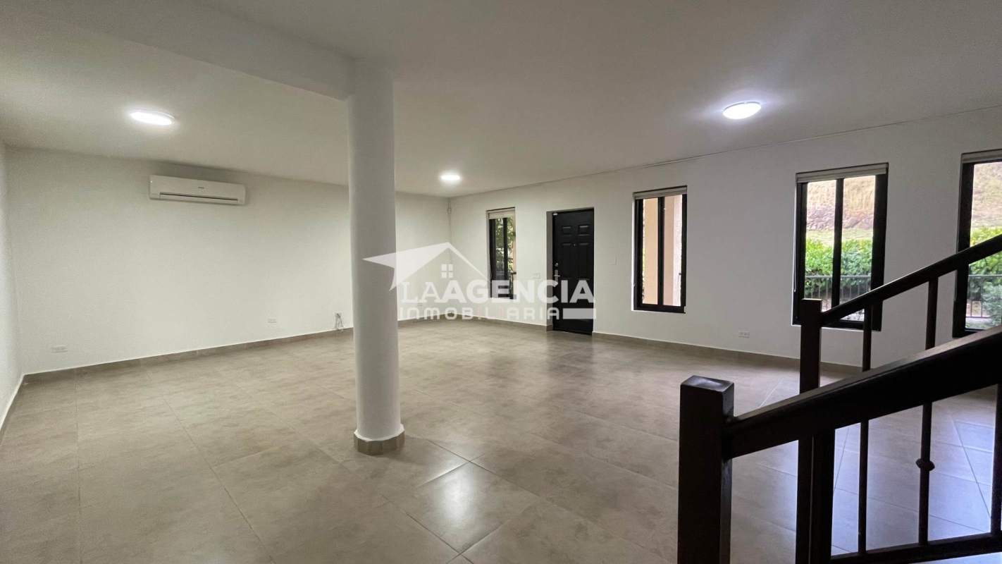 Bright living and dining room with porcelain floors in Embassy Club Clayton Panama City townhouse