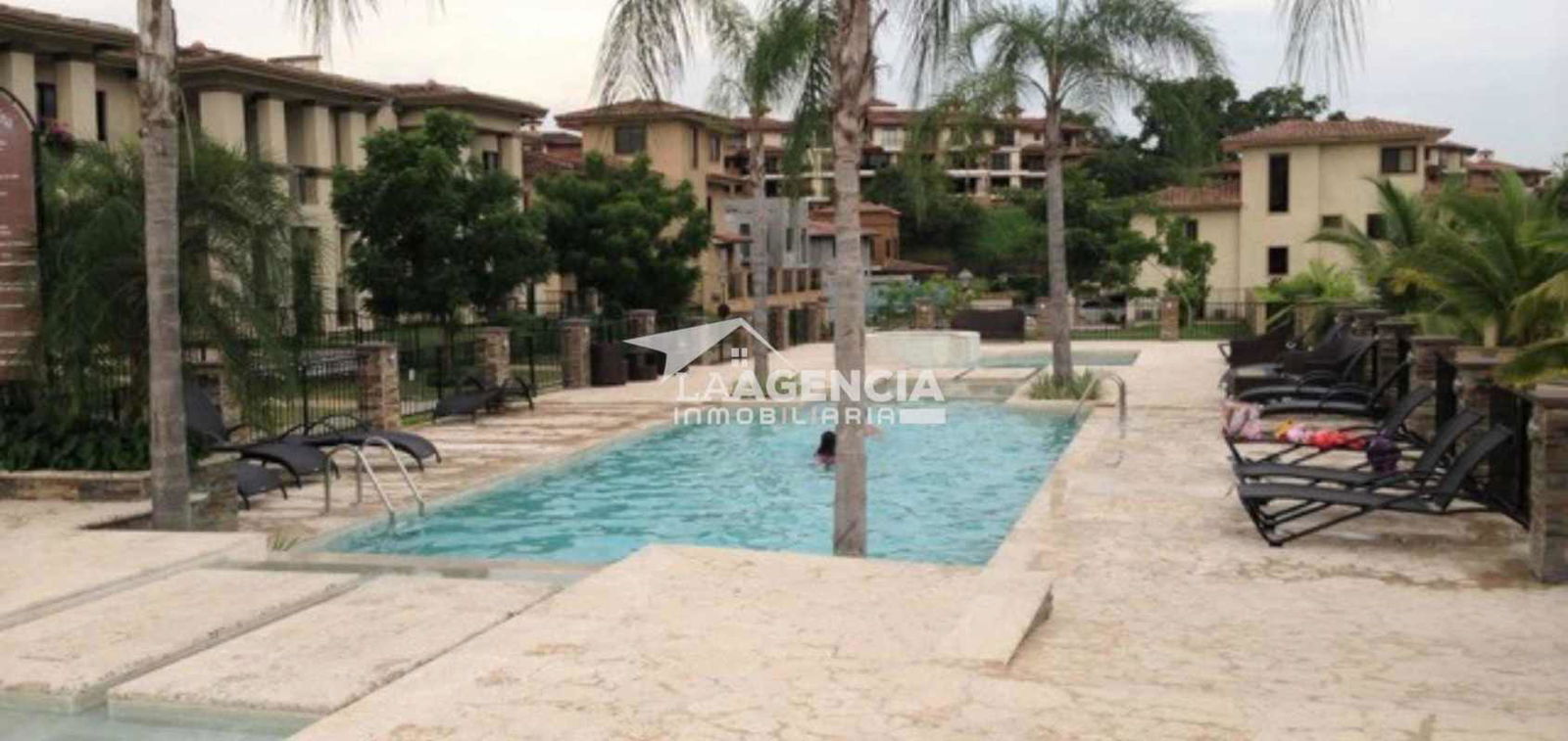 Resort-style swimming pools surrounded by gardens at Embassy Club Residences Clayton Panama