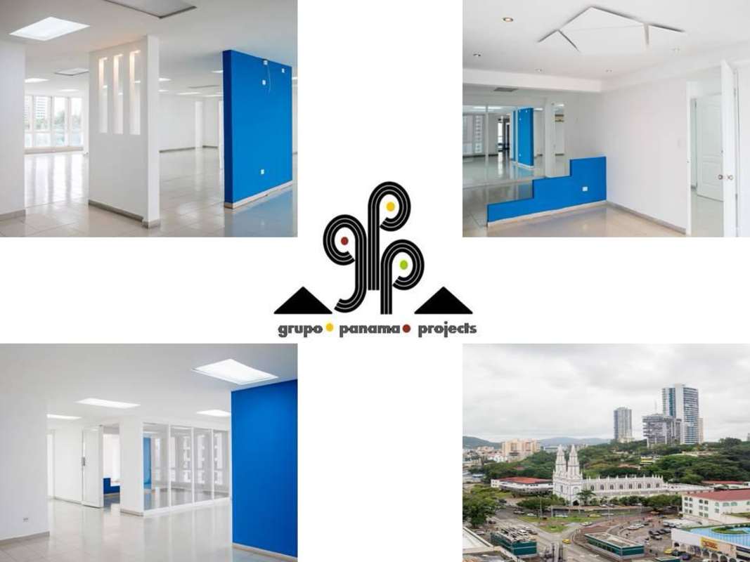 Bright open plan office space with blue accent wall, large windows, modern lighting PH BICSA Financial Center Panama