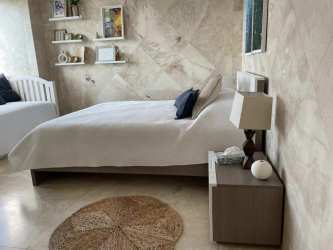 Modern spacious living room with floor-to-ceiling ocean view windows at Coronado Country Club Panama