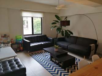 Spacious living room with large window garden view PH River Valley Panama