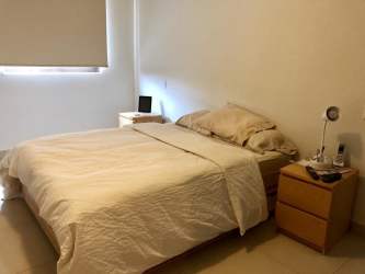 Kitchen with island and dining table at PH River Valley Panama Pacifico