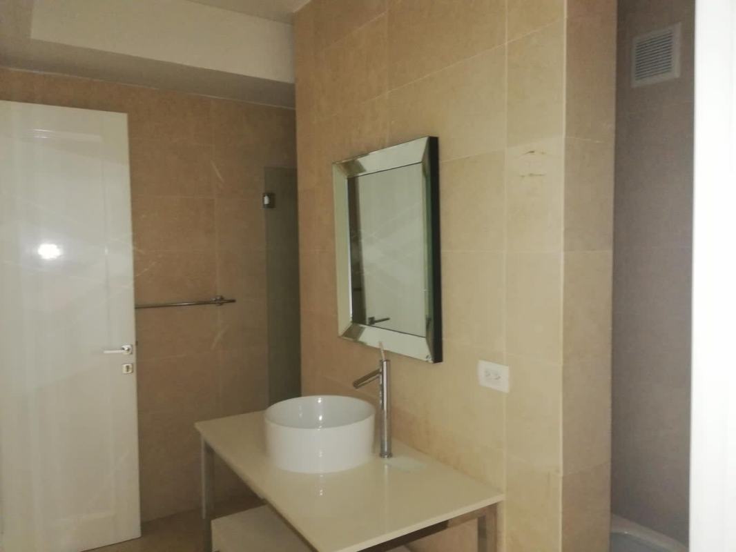 Luxury bathroom with stone countertops, full glass shower PH Yoo Panama Panama City