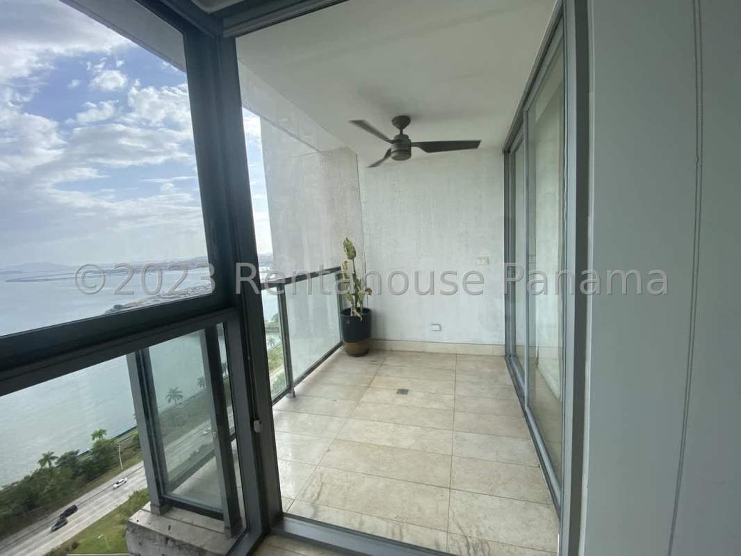 Master bedroom with built-in wardrobes and panoramic water views PH Yoo Panama