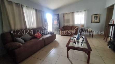 Single level house with pitched roof, driveway, and garden in Summer Hills Costa Verde Panama