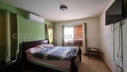 Dining space adjacent to living room with ceramic floors in Summer Hills Costa Verde Panama