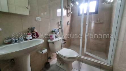 Modern bathroom with glass shower and pedestal sink in Summer Hills Costa Verde Panama