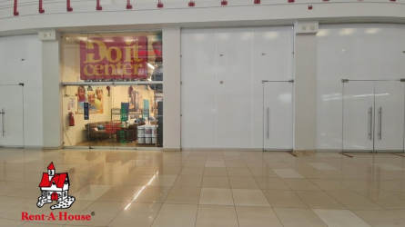 Modern shopping mall corridor with multiple storefronts at Westland Mall in Arraiján Panama