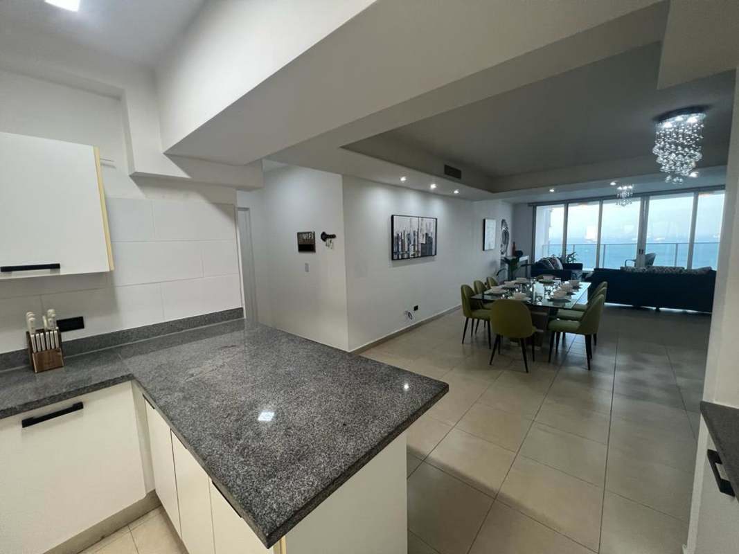 Expansive living dining space with panoramic ocean views in PH Water on the Bay Panama City