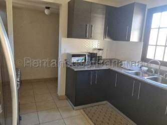 Modern bathroom with glass-enclosed shower, tiled walls and floor in Sunset Hills La Chorrera