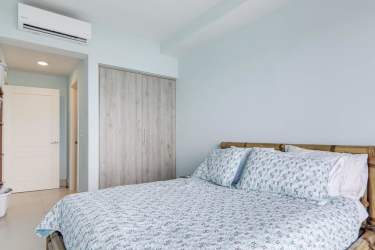 Bright living and dining open space with panoramic ocean views, terrace access, elegant finishings at Punta Caelo Penthouse Panama