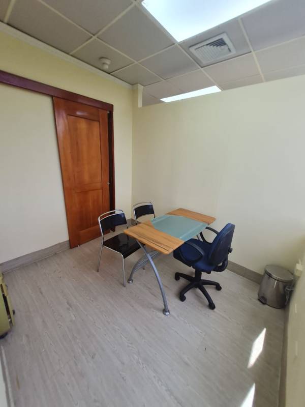 Minimalist office with glass desk for medical professional Consultorios San Fernando Panama