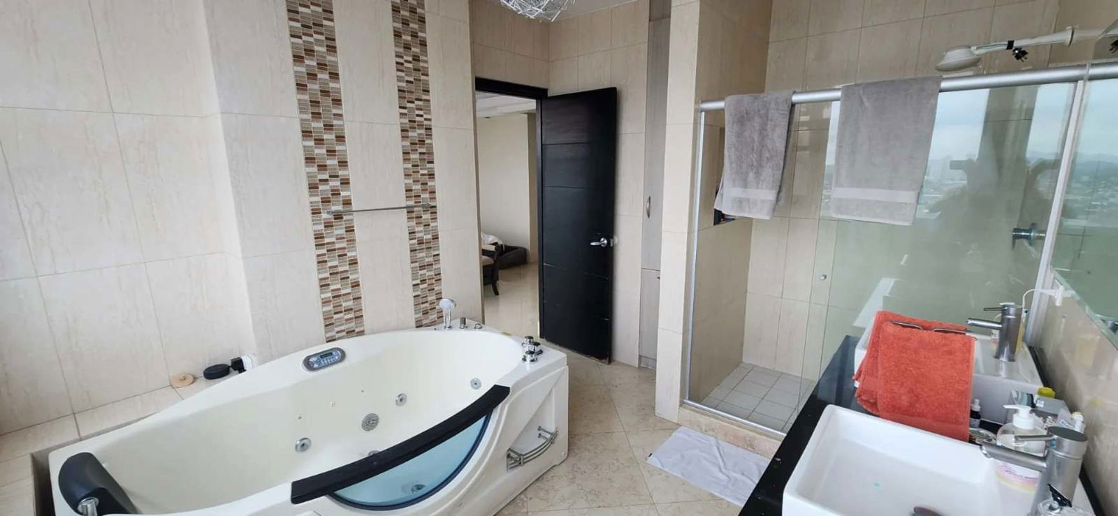 Modern marble-finished kitchen with central island and view in PH Highland View Hato Pintado Panama