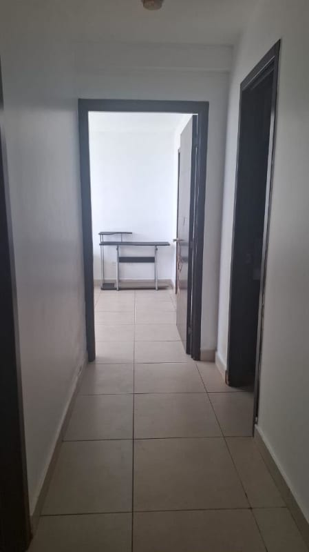 Bedroom with large window, closet, AC unit at PH Kings Park Condado del Rey Panama City