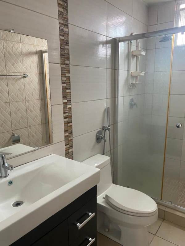 Bathroom with glass shower enclosure, modern design PH Kings Park Panama City