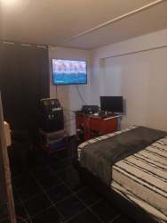 Bedroom minimalist blue accent wall tile floor affordable apartment David Panama