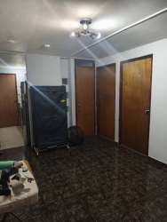 Interior hall with multiple doors tile floors apartment in downtown David