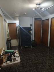 Hallway with ceiling fan multiple doors affordable apartment central David