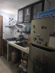 Small functional kitchen with refrigerator stove cabinets David Panama apartment