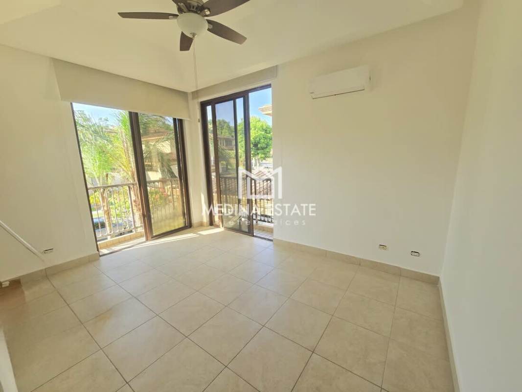 Large double-height living room with floor-to-ceiling windows Embassy Club Clayton Panama